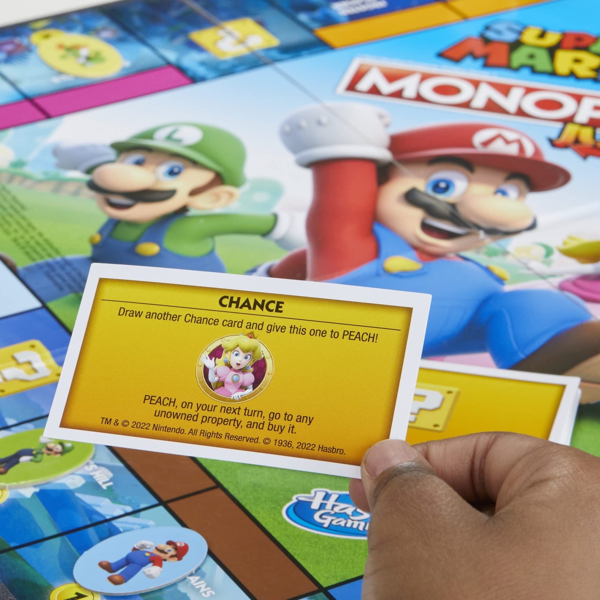 Monopoly Junior Super Mario Edition Board Game, Fun Kids' Ages 5 and Up, Explore The Mushroom Kingdom as Mario, Peach, Yoshi, or Luigi ( Exclusive)